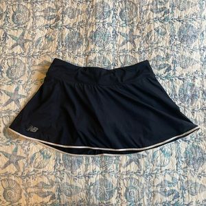 New Balance Women’s Navy tennis skirt with built in shorts